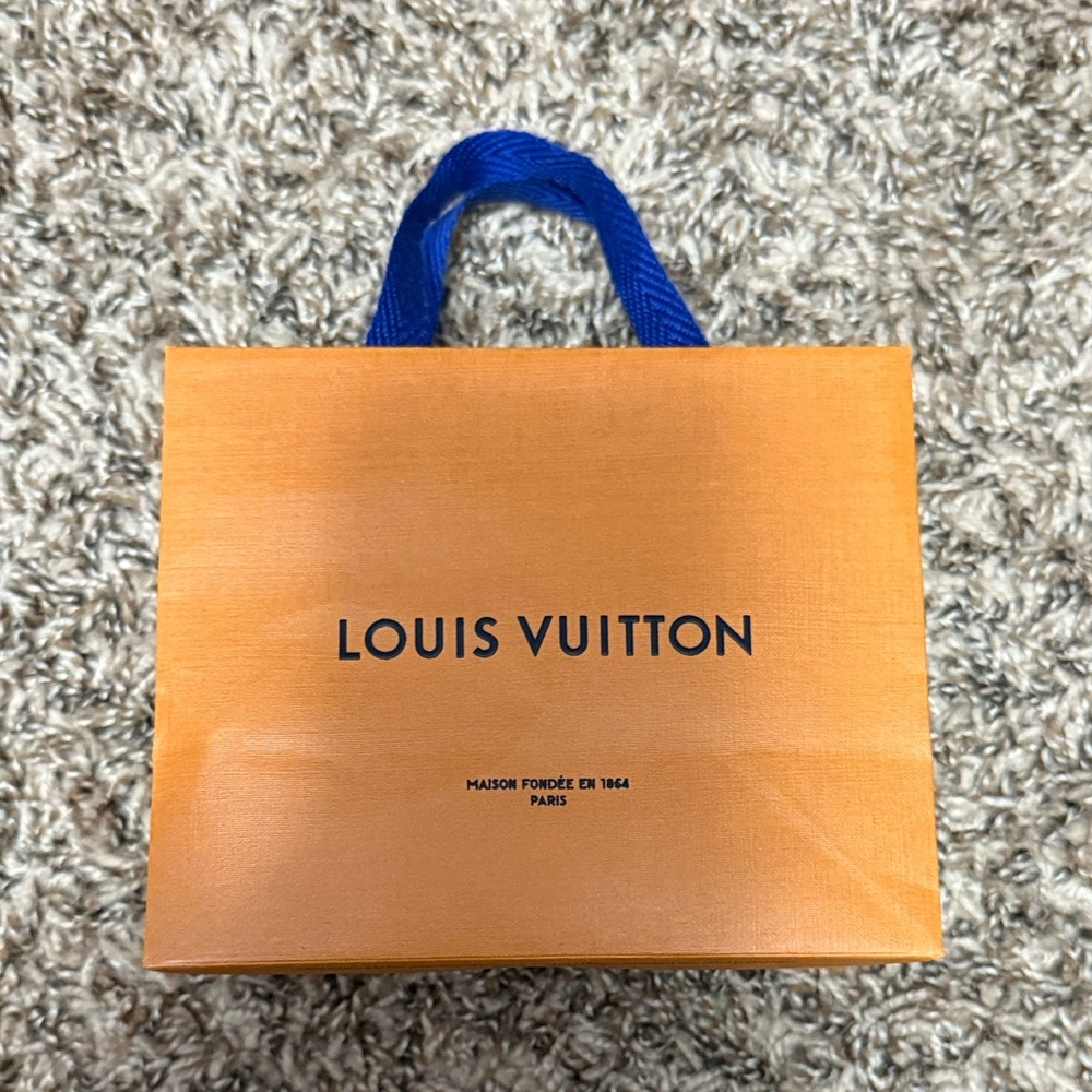 Louis Vuitton Vibrant Orange Bag with Bold Blue Handles